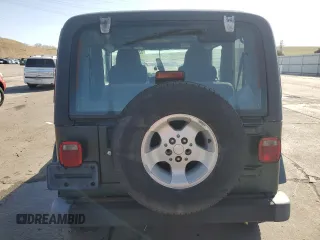 2003 Jeep Wrangler Sahara z VIN 1J4FA59SX3P302622, wystawiony jako Copart lot #52756105 z przebiegiem 181 900 mil mil oraz Szkoda całkowita • Salvage title. Historia ofert i sprzedaży dostępna na DreamBid. Obrazek 6.
