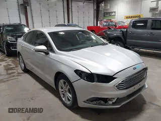 2018 Ford Fusion SE z VIN 3FA6P0HD1JR193473, wystawiony jako IAAI lot #42644651 z przebiegiem 49 256 mil mil oraz . Historia ofert i sprzedaży dostępna na DreamBid. Obrazek 1.