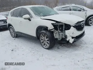 2015 Mazda CX-5 Grand Touring with VIN JM3KE2DY5F0451690, listed as a IAAI auction lot 41570379 with 1 mi miles. Bid and sale history available at carsss.com. Image 1.