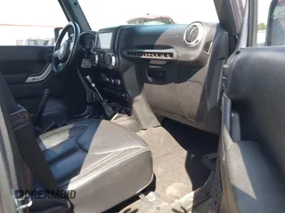 2015 Jeep Wrangler Unlimited Sahara with VIN 1C4BJWEG2FL558860, listed as a IAAI auction lot 41937360 with 113,627 mi miles. Bid and sale history available at carsss.com. Image 5.