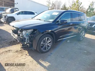 2021 Cadillac XT6 Premium Luxury with VIN 1GYKPFRS9MZ141298, listed as a IAAI auction lot 41304705 with 87,470 mi miles. Bid and sale history available at carsss.com. Image 2.