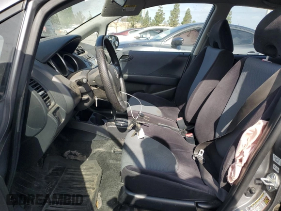 2007 Honda Fit z VIN JHMGD38447S026125, wystawiony jako Copart lot #56554145 z przebiegiem 227 284 mil mil oraz Szkoda całkowita • Salvage title. Historia ofert i sprzedaży dostępna na DreamBid. Obrazek 7.