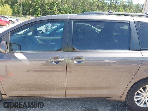 2012 Toyota Sienna XLE AAS with VIN 5TDYK3DC5CS259216, listed as a IAAI auction lot 42143551 with 219,957 mi miles and . Bid and sale history available at DreamBid. Image 14.