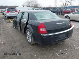 2006 Chrysler 300 C with VIN 2C3KA63H06H189591, listed as a IAAI auction lot 41810691 with 184,465 mi miles. Bid and sale history available at carsss.com. Image 3.