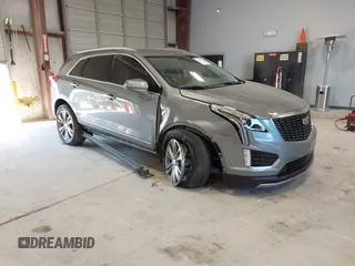 2023 Cadillac XT5 FWD Premium Luxury z VIN 1GYKNCR42PZ178252, wystawiony jako IAAI lot #41394913 z przebiegiem 28 751 mil mil oraz . Historia ofert i sprzedaży dostępna na DreamBid. Obrazek 1.