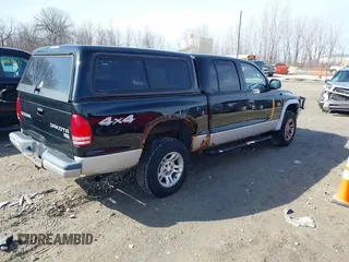 2004 Dodge Dakota SLT with VIN 1D7HG48N54S734087, listed as a IAAI auction lot 41770151 with 129,514 mi miles. Bid and sale history available at carsss.com. Image 4.