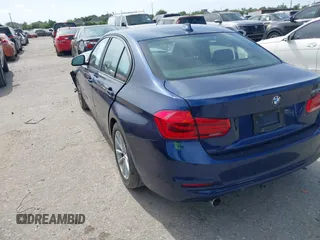 2018 BMW 3 Series 320i with VIN WBA8E1G56JNU92997, listed as a IAAI auction lot 42039869 with 105,085 mi miles. Bid and sale history available at carsss.com. Image 3.