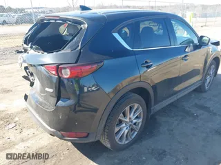 2019 Mazda CX-5 Grand Touring with VIN JM3KFBDM2K0603297, listed as a IAAI auction lot 41668241 with 54,583 mi miles. Bid and sale history available at carsss.com. Image 4.