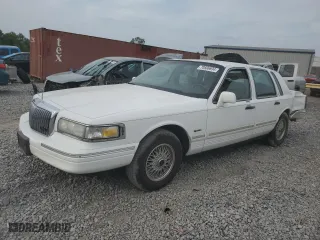 1997 Lincoln Town Car Signature with VIN 1LNLM82W2VY697709, listed as a Copart auction lot 70506934 with 200,288 mi miles and Salvage Title. Bid and sale history available at carsss.com. Image 1.
