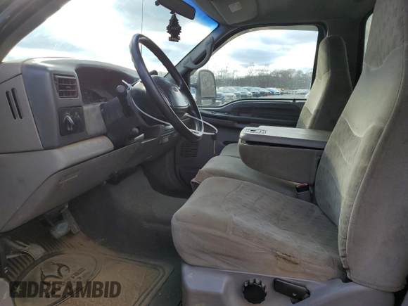 2000 Ford F-250 with VIN 1FTNF21S9YEA14056, listed as a Copart auction lot 80151994 with 165,477 mi miles and Salvage title. Bid and sale history available at DreamBid. Image 7.