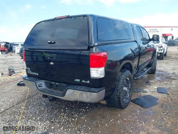 2010 Toyota Tundra 4WD Truck with VIN 5TFUW5F14AX121698, listed as a IAAI auction lot 41582570 with 1 mi miles. Bid and sale history available at carsss.com. Image 4.