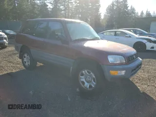 1999 Toyota RAV4 with VIN JT3GP10VXX0038569, listed as a Copart auction lot 45241935 with 311,042 mi miles and Clean Title. Bid and sale history available at DreamBid. Image 4.