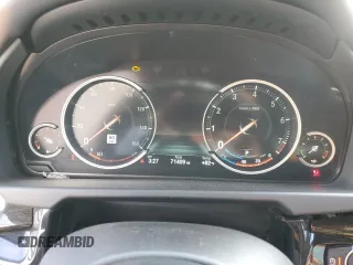 2015 BMW X6 xDrive50i with VIN 5UXKU6C56F0F93641, listed as a Copart auction lot 77233553 with 71,409 mi miles. Bid and sale history available at carsss.com. Image 9.