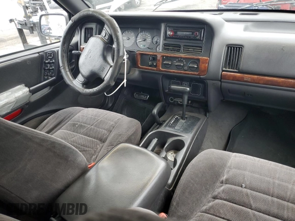 1997 Jeep Grand Cherokee Laredo with VIN 1J4GZ58S0VC771727, listed as a Copart auction lot 82233224 with 320,213 mi miles and Salvage Title. Bid and sale history available at carsss.com. Image 8.