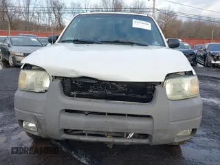 2002 Ford Escape XLT Choice with VIN 1FMYU04142KD82594, listed as a IAAI auction lot 41574646 with 173,174 mi miles. Bid and sale history available at carsss.com. Image 6.