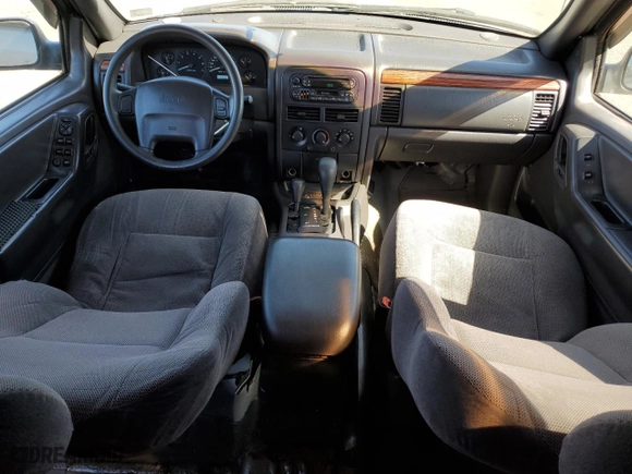 1999 Jeep Grand Cherokee Laredo with VIN 1J4GW58N4XC739465, listed as a Copart auction lot 76130544 with 195,649 mi miles and Salvage Title. Bid and sale history available at carsss.com. Image 8.