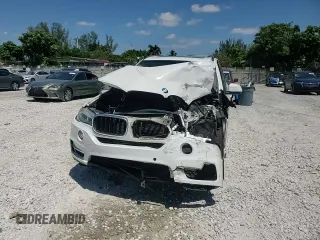 2014 BMW X5 xDrive35i with VIN 5UXKR0C52E0H20513, listed as a Copart auction lot 52831615 with 111,414 mi miles and Salvage Title. Bid and sale history available at carsss.com. Image 12.