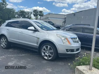 2011 Cadillac SRX Premium Collection z VIN 3GYFNCEY2BS663118, wystawiony jako Copart lot #57292295 z przebiegiem 74 541 mil mil oraz Czysty tytuł • Clean title. Historia ofert i sprzedaży dostępna na DreamBid. Obrazek 1.