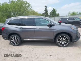 2020 Honda Pilot Elite with VIN 5FNYF6H00LB027472, listed as a IAAI auction lot 42253478 with 69,988 mi miles and . Bid and sale history available at DreamBid. Image 13.