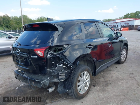 2016 Mazda CX-5 Touring with VIN JM3KE2CY5G0653108, listed as a IAAI auction lot 37717249 with 90,704 mi miles and . Bid and sale history available at DreamBid. Image 4.