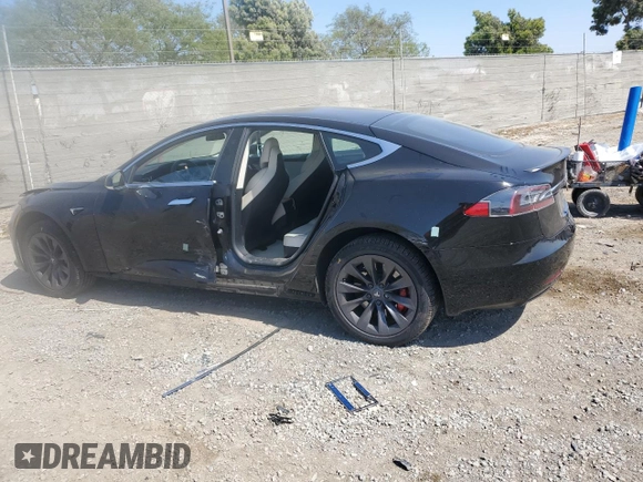 2019 Tesla Model S 100D with VIN 5YJSA1E42KF331240, listed as a Copart auction lot 54713975 with 43,940 mi miles and Salvage title. Bid and sale history available at DreamBid. Image 2.