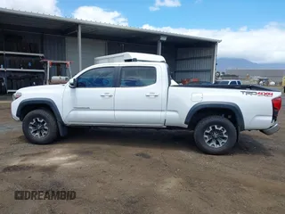 2018 Toyota Tacoma SR5 with VIN 3TMDZ5BN5JM048038, listed as a IAAI auction lot 42084922 with 79,718 mi miles and . Bid and sale history available at DreamBid. Image 14.