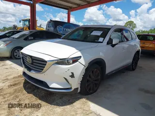 2016 Mazda CX-9 Grand Touring with VIN JM3TCADYXG0113563, listed as a IAAI auction lot 42593120 with 237,696 mi miles and . Bid and sale history available at DreamBid. Image 17.