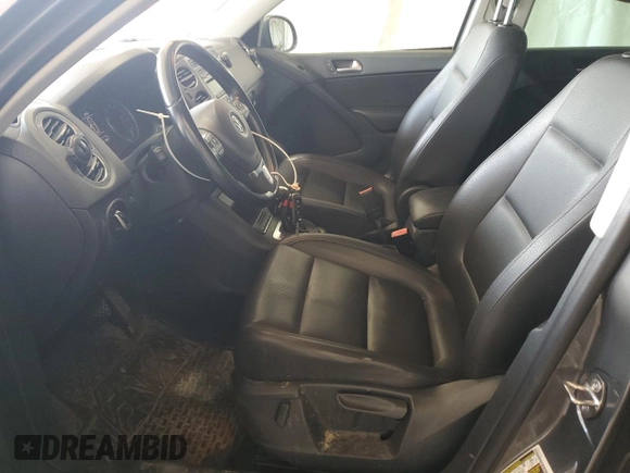 2014 Volkswagen Tiguan SEL with VIN WVGBV3AX2EW541476, listed as a Copart auction lot 64817795 with 158,032 mi miles and Salvage title. Bid and sale history available at DreamBid. Image 7.