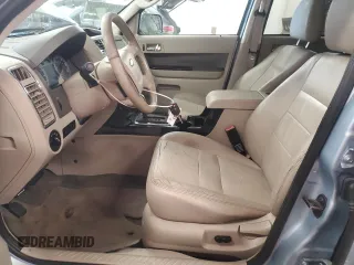 2009 Ford Escape Hybrid with VIN 1FMCU49399KA29841, listed as a Copart auction lot 64803435 with 131,289 mi miles and Salvage title. Bid and sale history available at DreamBid. Image 7.