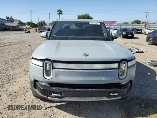 2022 Rivian R1T Adventure z VIN 7FCTGAAA0NN010103, wystawiony jako Copart lot #53312035 z przebiegiem 48 333 mil mil oraz Szkody całkowita. Historia ofert i sprzedaży dostępna na DreamBid. Obrazek 5.