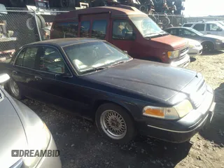 2001 Ford Crown Victoria LX z VIN 2FAFP74W11X122548, wystawiony jako IAAI lot #40803915 z przebiegiem 186 912 mil mil oraz . Historia ofert i sprzedaży dostępna na DreamBid. Obrazek 1.