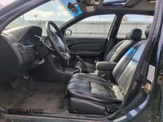 1997 Nissan Maxima GXE with VIN JN1CA21D0VT201140, listed as a Copart auction lot 52230495 with 286,440 mi miles and Clean title. Bid and sale history available at DreamBid. Image 7.
