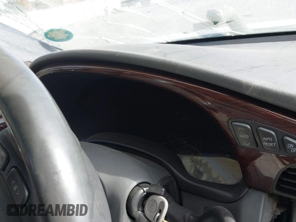 2004 Cadillac DeVille DHS z VIN 1G6KE57Y74U119605, wystawiony jako IAAI lot #40555057 z przebiegiem Nie podano mil oraz . Historia ofert i sprzedaży dostępna na DreamBid. Obrazek 7.