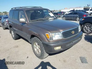 2000 Toyota Land Cruiser with VIN JT3HT05J7Y0120955, listed as a IAAI auction lot 41749823 with 323,079 mi miles. Bid and sale history available at carsss.com. Image 1.
