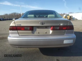 1999 Toyota Camry LE z VIN JT2BF22K4X0199123, wystawiony jako Copart lot #53456665 z przebiegiem 181 526 mil mil oraz Szkoda całkowita • Salvage title. Historia ofert i sprzedaży dostępna na DreamBid. Obrazek 6.
