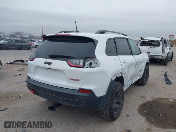 2019 Jeep Cherokee Trailhawk with VIN 1C4PJMBN6KD124023, listed as a IAAI auction lot 41432217 with 76,934 mi miles and . Bid and sale history available at DreamBid. Image 4.