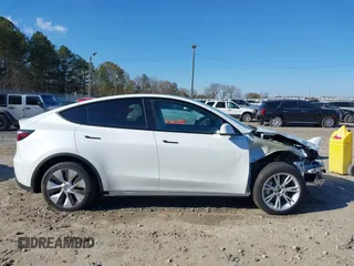 2023 Tesla Model Y Long Range with VIN 7SAYGAEE1PF828338, listed as a IAAI auction lot 40978725 with Not Provided miles and . Bid and sale history available at DreamBid. Image 14.