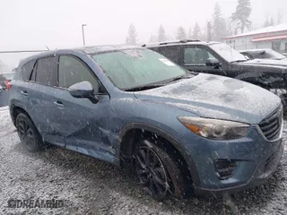 2016 Mazda CX-5 Grand Touring with VIN JM3KE4DY4G0687230, listed as a IAAI auction lot 41510915 with NaN miles. Bid and sale history available at carsss.com. Image 6.