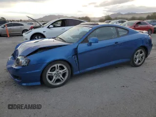 2005 Hyundai Tiburon GT z VIN KMHHN65F45U183144, wystawiony jako Copart lot #87487994 z przebiegiem 59 582 mil mil oraz Szkody całkowita. Historia ofert i sprzedaży dostępna na DreamBid. Obrazek 1.