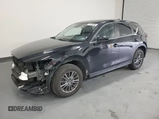 2021 Mazda CX-5 Touring with VIN JM3KFBCMXM0338844, listed as a Copart auction lot 53201615 with 137,498 mi miles and Clean Title. Bid and sale history available at carsss.com. Image 1.