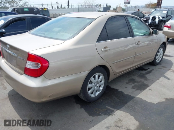 2002 Toyota Camry LE z VIN 4T1BE32K72U078387, wystawiony jako IAAI lot #42052328 z przebiegiem 157 394 mil mil oraz . Historia ofert i sprzedaży dostępna na DreamBid. Obrazek 4.