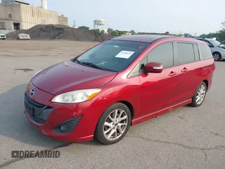 2014 Mazda 5 Grand Touring z VIN JM1CW2DL7E0166678, wystawiony jako IAAI lot #42438124 z przebiegiem 117 775 mil mil oraz . Historia ofert i sprzedaży dostępna na DreamBid. Obrazek 2.