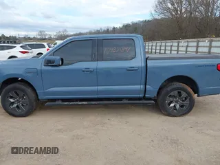 2023 Ford F-150 Lightning Pro with VIN 1FT6W1EVXPWG34958, listed as a IAAI auction lot 41732898 with 10,573 mi miles and . Bid and sale history available at DreamBid. Image 14.