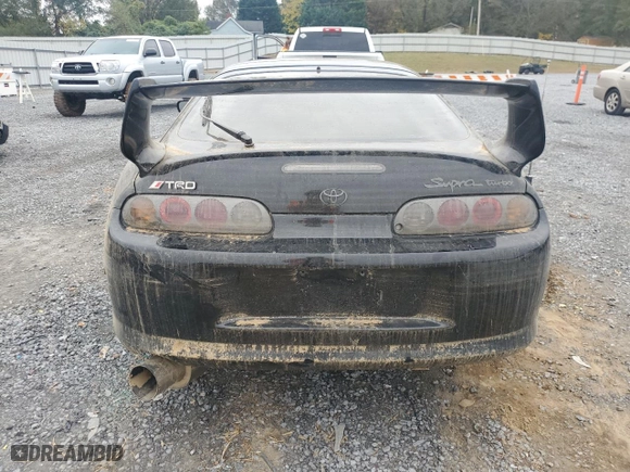 1997 Toyota Supra with VIN JT2DE82A0V0037380, listed as a Copart auction lot 74052604 with NaN miles and Salvage Title. Bid and sale history available at carsss.com. Image 6.