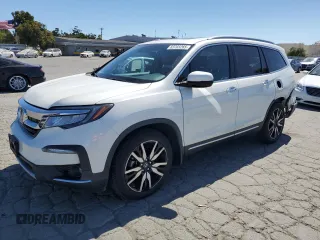 2019 Honda Pilot Touring 7-Passenger with VIN 5FNYF5H69KB006701, listed as a Copart auction lot 63703265 with 30,513 mi miles and Salvage title. Bid and sale history available at DreamBid. Image 1.