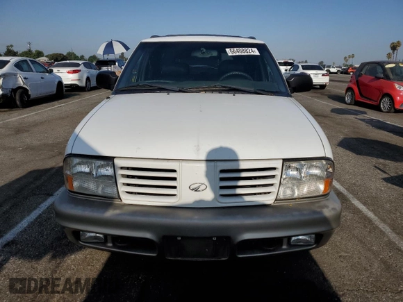 2000 Oldsmobile Bravada z VIN 1GHDT13W7Y2351268, wystawiony jako Copart lot #66408824 z przebiegiem 134 512 mil mil oraz Tytuł czysty. Historia ofert i sprzedaży dostępna na DreamBid. Obrazek 5.