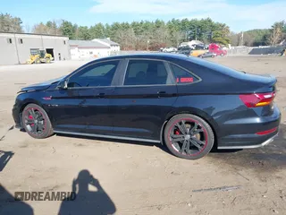 2019 Volkswagen Jetta GLI S z VIN 3VW5T7BU1KM156888, wystawiony jako IAAI lot #40778065 z przebiegiem 97 114 mil mil oraz . Historia ofert i sprzedaży dostępna na DreamBid. Obrazek 14.