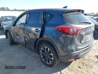 2016 Mazda CX-5 Grand Touring with VIN JM3KE4DY8G0823567, listed as a IAAI auction lot 41784384 with 143,836 mi miles and . Bid and sale history available at carsss.com. Image 3.