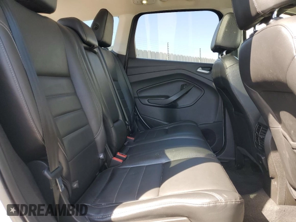 2016 Ford Escape Titanium with VIN 1FMCU0J99GUB83458, listed as a Copart auction lot 48828195 with 74,250 mi miles and Salvage Title. Bid and sale history available at carsss.com. Image 12.