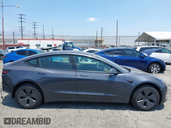 2023 Tesla Model 3 with VIN 5YJ3E1EA4PF400306, listed as a IAAI auction lot 42398603 with 18,551 mi miles and . Bid and sale history available at DreamBid. Image 14.
